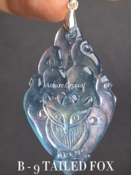B - 9 TAIL FOX Top tier handcarved Aquamarine pendant
